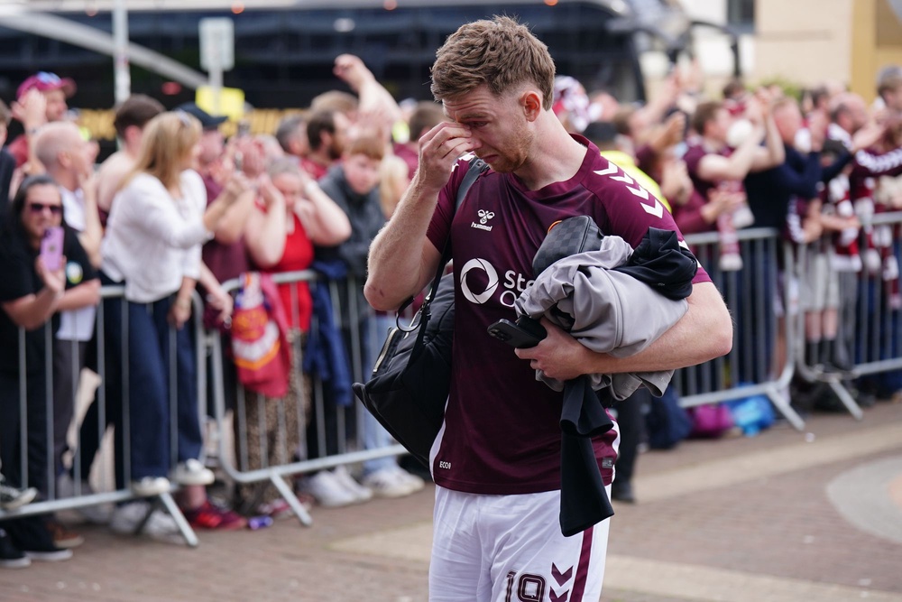 Heart of Midlothian player Stuart Findlay becomes emotional as he walks past fans (Jane Barlow/PA Wire)