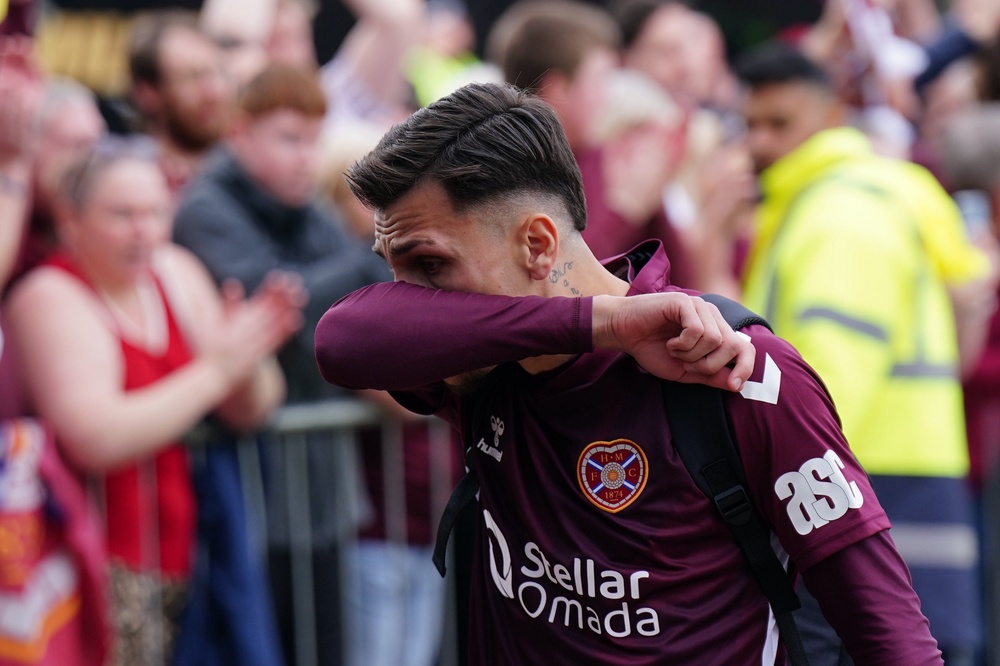 Heart of Midlothian player Alexandros Kyziridis becomes emotional as he walks past fans (Jane Barlow/PA Wire)