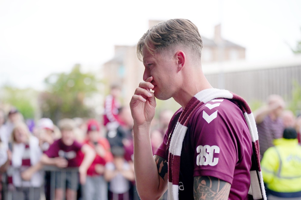 Heart of Midlothian player Frankie Kent becomes emotional as he walks past fans (Jane Barlow/PA Wire)