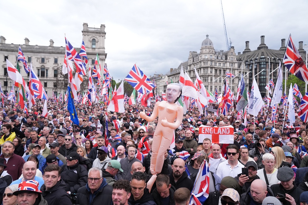 Protesters at the Unite the Kingdom march (People take part in Tommy Robinson’s Unite the Kingdom march /PA) (PA Wire)