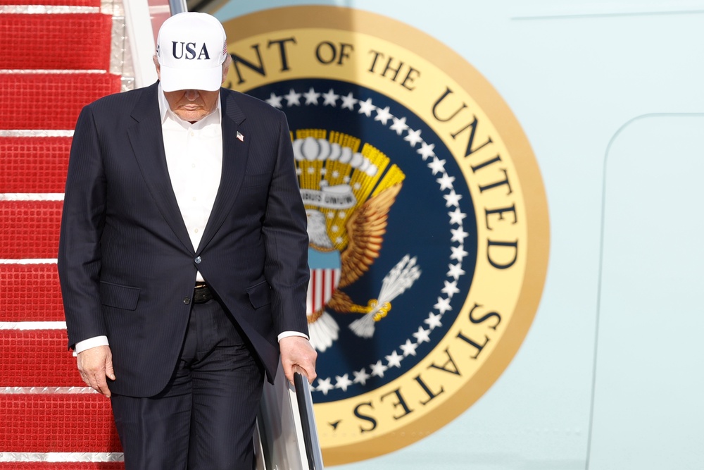 President Donald Trump walks down the stairs of Air Force One (AP Photo/Luis M. Alvarez)