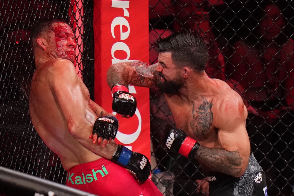 Mike Perry (right) forced a stoppage of Nate Diaz between the second and third rounds (AP)