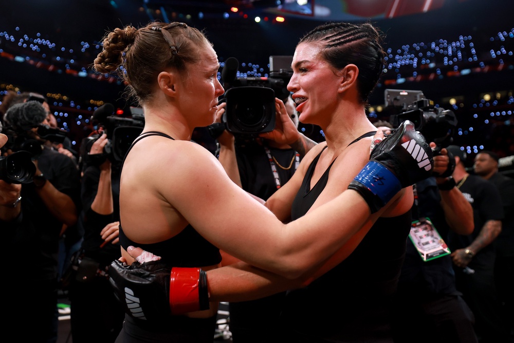 Rousey and Carano embracing after their fight in California (Getty)