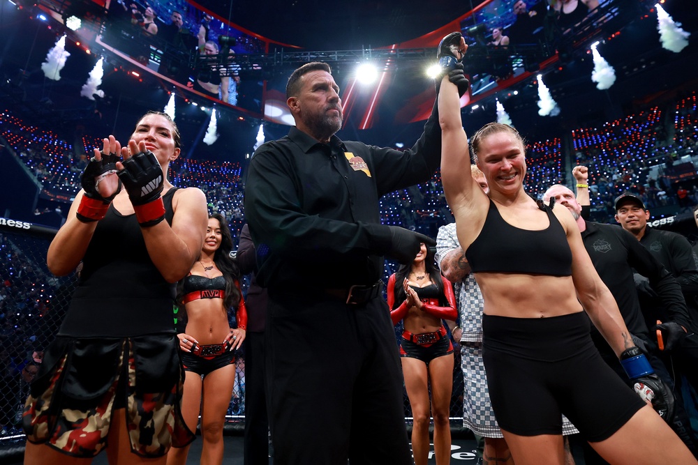 Ronda Rousey (right) has her hand raised after beating Gina Carano (Getty)