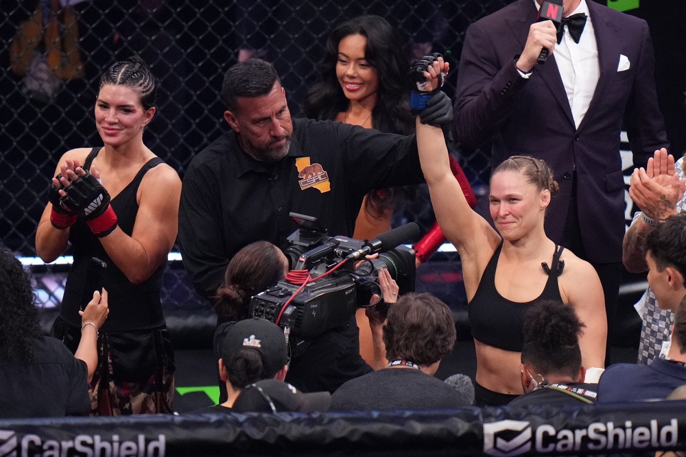 Ronda Rousey (right) is congratulated by beaten opponent Gina Carano (left) (AP)
