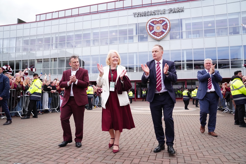 Hearts minority owner Tony Bloom (left) and former Heart of Midlothian owner Ann Budge acknowledge the fans at Tynecastle (PA)