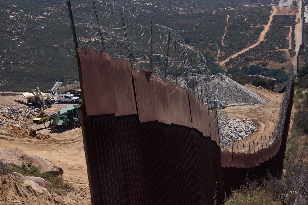 US border policy has long intentionally funneled migrants towards remote areas and clandestine crossings, a move critics say increases the risk of death for border-crossers (AP)