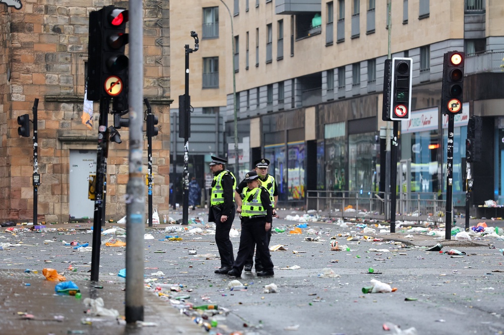 Police officers on the streets of Glasgow after Celtic won the William Hill Premiership title after a 3-1 win at home to Hearts (Steve Welsh/PA) (PA Wire)