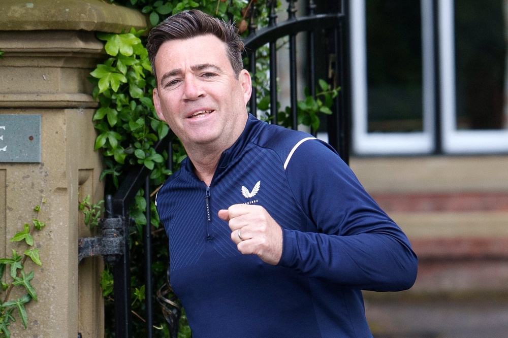 Supporters of the Mayor of Greater Manchester Andy Burnham have also called for the prime minister to resign, ahead of a likely leadership challenge in the weeks ahead (AP)