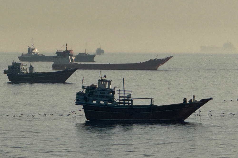 Vessels are seen anchored in the Strait of Hormuz, near the port of Khasab on Oman’s northern Musandam Peninsula, on Sunday (AFP/Getty)