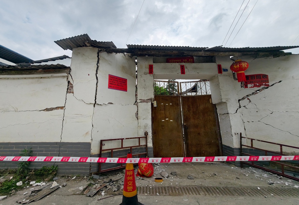 A damaged building is seen after an earthquake at Liunan district, in Liuzhou (AFP/Getty)