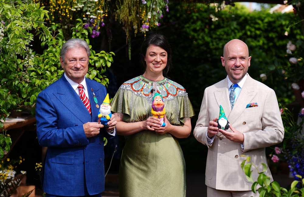 Alan Titchmarsh, Frances Tophill and Tom Allen holding the gnomes they have painted to raise money for the RHS Campaign for School Gardening (Aaron Chown/PA)