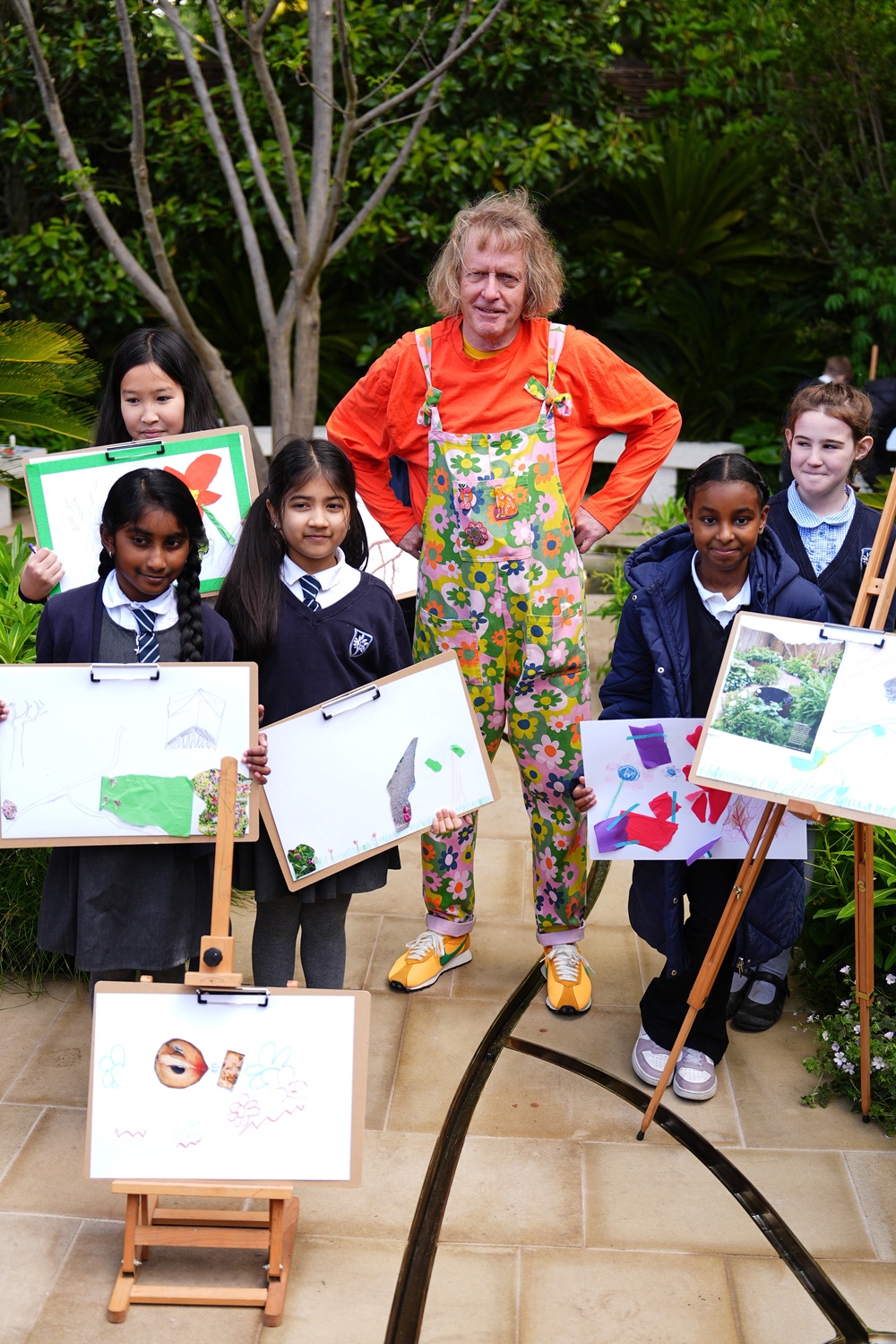 Grayson Perry with children from a local primary school during an art activity at the Tate Britain Garden (Aaron Chown/PA)