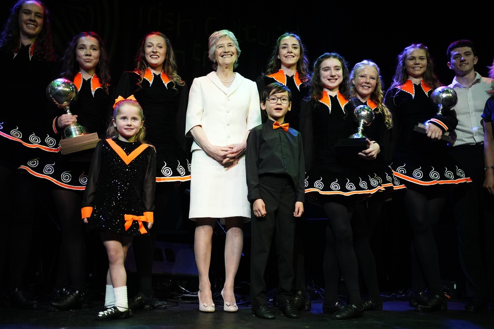 Irish President Catherine Connolly with Irish dancers who performed during her visit to the Irish Cultural Centre in Hammersmith (Jordan Pettitt/PA)