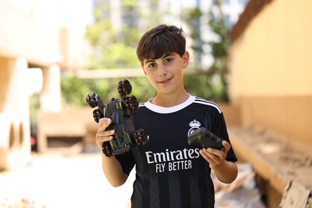 Wael, 10, has been collecting toy cars for five years (Save the Children)
