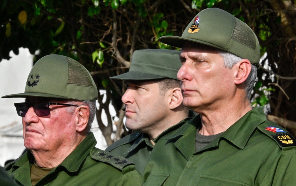 Cuba's President Miguel Diaz-Canel (R), Colonel Raul Guillermo Rodriguez Castro (C),  grandson of former President Raul Castro, and Armed Forces Minister General Alvaro Lopez Miera attend the funeral of the 32 Cuban soldiers killed during the US incursion in Venezuela (AFP/Getty)