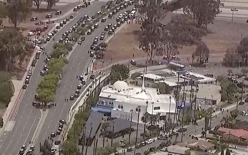 Aerial footage showed dozens of police vehicles lining a road near the Islamic center (Reuters)