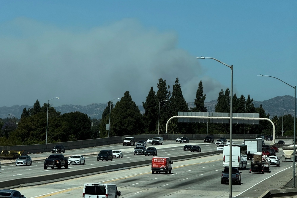 Aerial footage showed at least one residence ablaze, though officials did not provide an exact count (AP Photo/Ethan Swope)