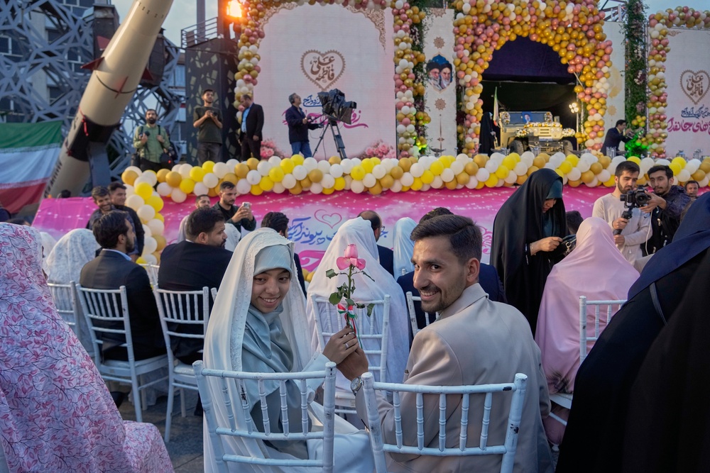 Photos of a mass wedding and a colorful missile at Tehran's 'Sacrifice for Iran' ceremony (Copyright 2026 The Associated Press. All rights reserved)