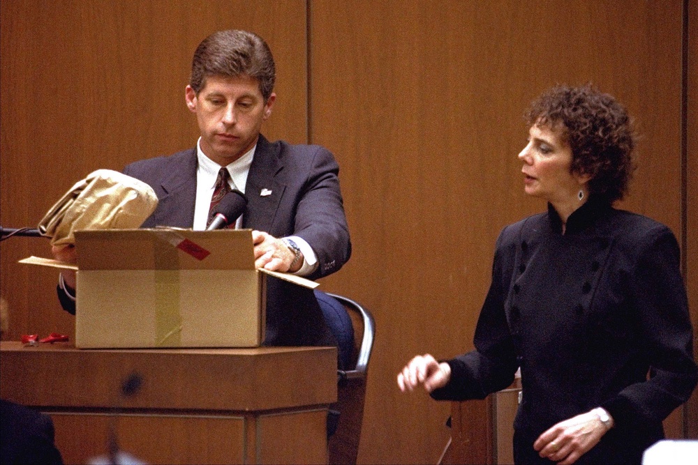 Los Angeles Police Detective Mark Fuhrman shows the jury in the O.J. Simpson double murder trial evidence during testimony (AP)