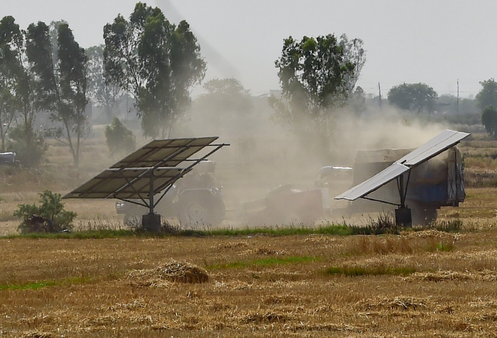 Solar panels are seen installed in an agriculture field in Haryana, India (Getty)