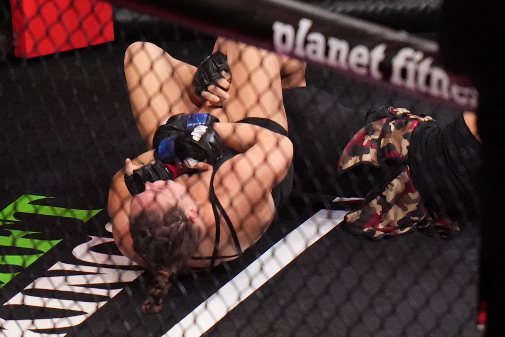 Ronda Rousey applying an armbar on Gina Carano (AP)
