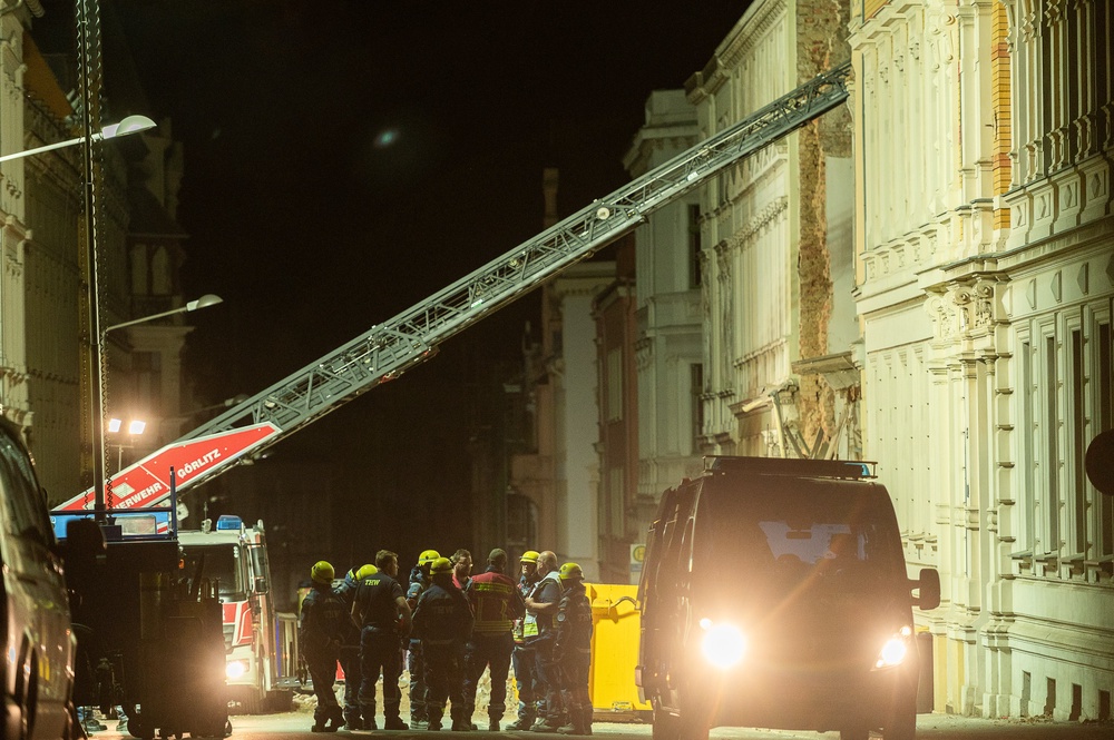 Emergency services at the scene last night (AP)