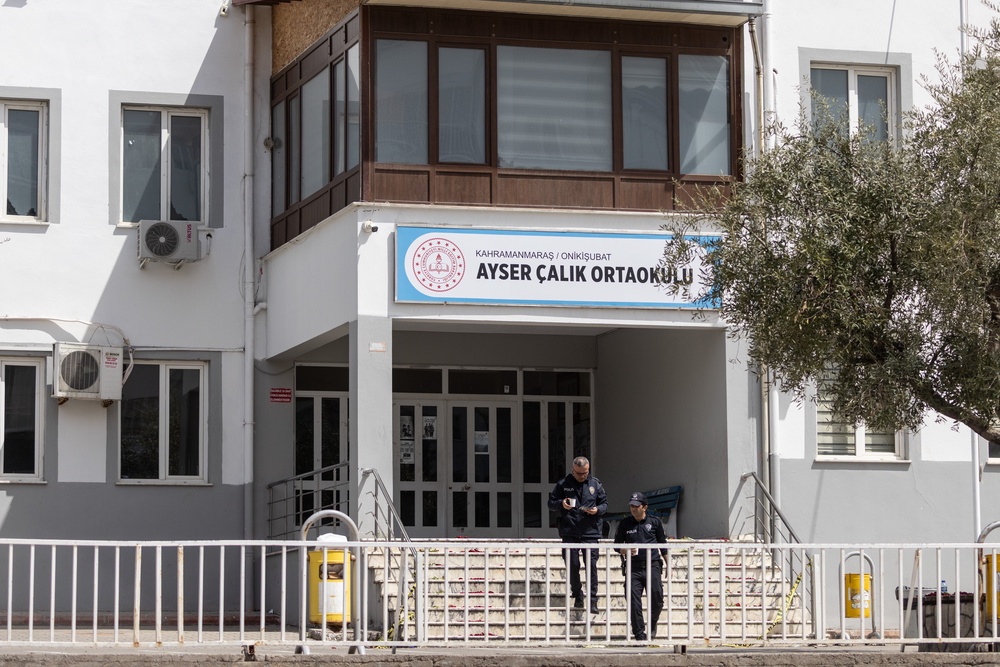 Police officers patrol in front of Ayser Calik middle school (Getty)