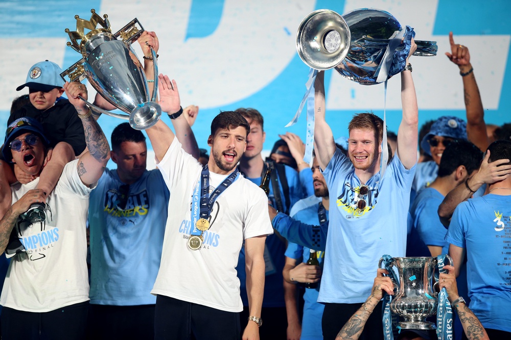 Enzo Maresca was part of Manchester City’s historic treble-winning 2022-23 campaign with Kevin De Bruyne (centre right) and Aymeric Laporte showing off trophies on stage amid the celebrations (Nigel French/PA) (PA Archive)