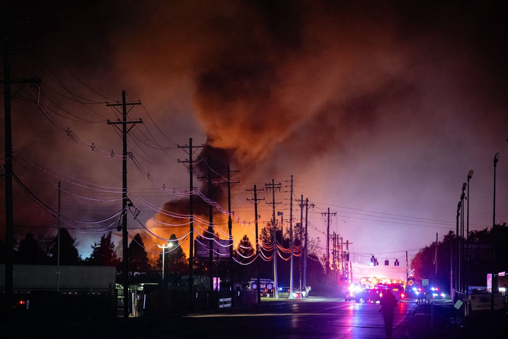 Plumes of smoke rise from the area of a UPS cargo plane crash at Louisville Muhammad Ali International Airport, Nov. 4, 2025, in Louisville (AP)