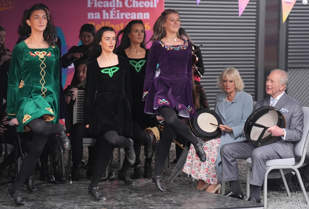 The royal visitors played the bodhran drums while dancers performed (Niall Carson/PA) (PA Wire)