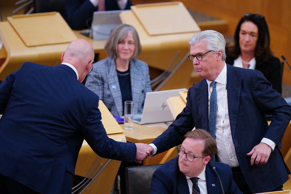 The First Minister shook the hands of all other leaders in the chamber (Jane Barlow/PA) (PA Wire)