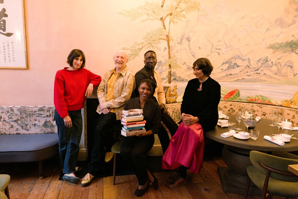 Judges Group with longlist books (Sophie Davidson/Booker Prize Foundation/PA)