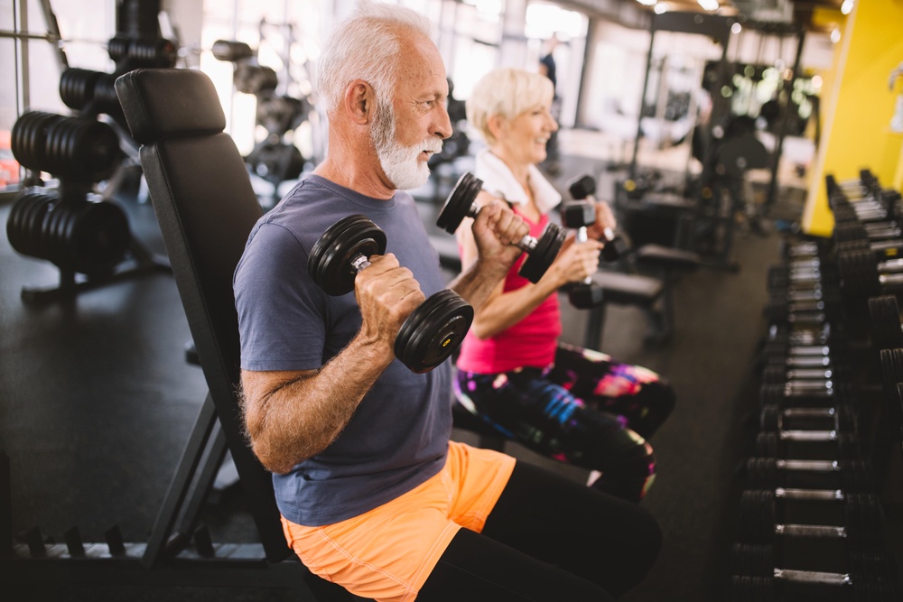 A man and a woman exercising in the gym (Alamy/PA)