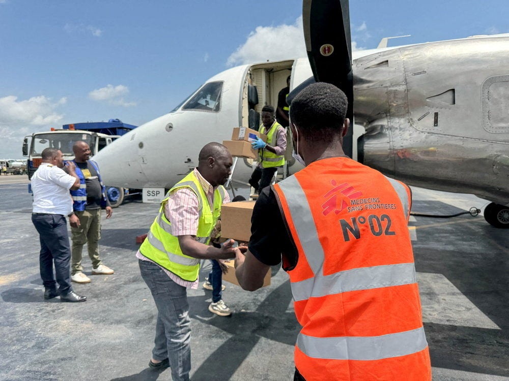 A Medecins Sans Frontieres (MSF) cargo flight is unloaded at Bunia airport with emergency response supplies (Reuters)