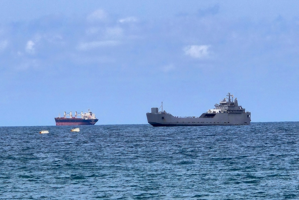 An Israeli naval vessel (R) is motored towards the Israeli port of Ashdod, about 40 kilometres south of Tel Aviv, on May 20, 2026, after Israeli forces intercepted the Gaza-bound Global Sumud Flotilla. (AFP/Getty)