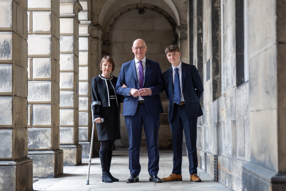 The First Minister was flanked by his wife Elizabeth and teenage son Matthew when he left the court (Jane Barlow/PA) (PA Wire)