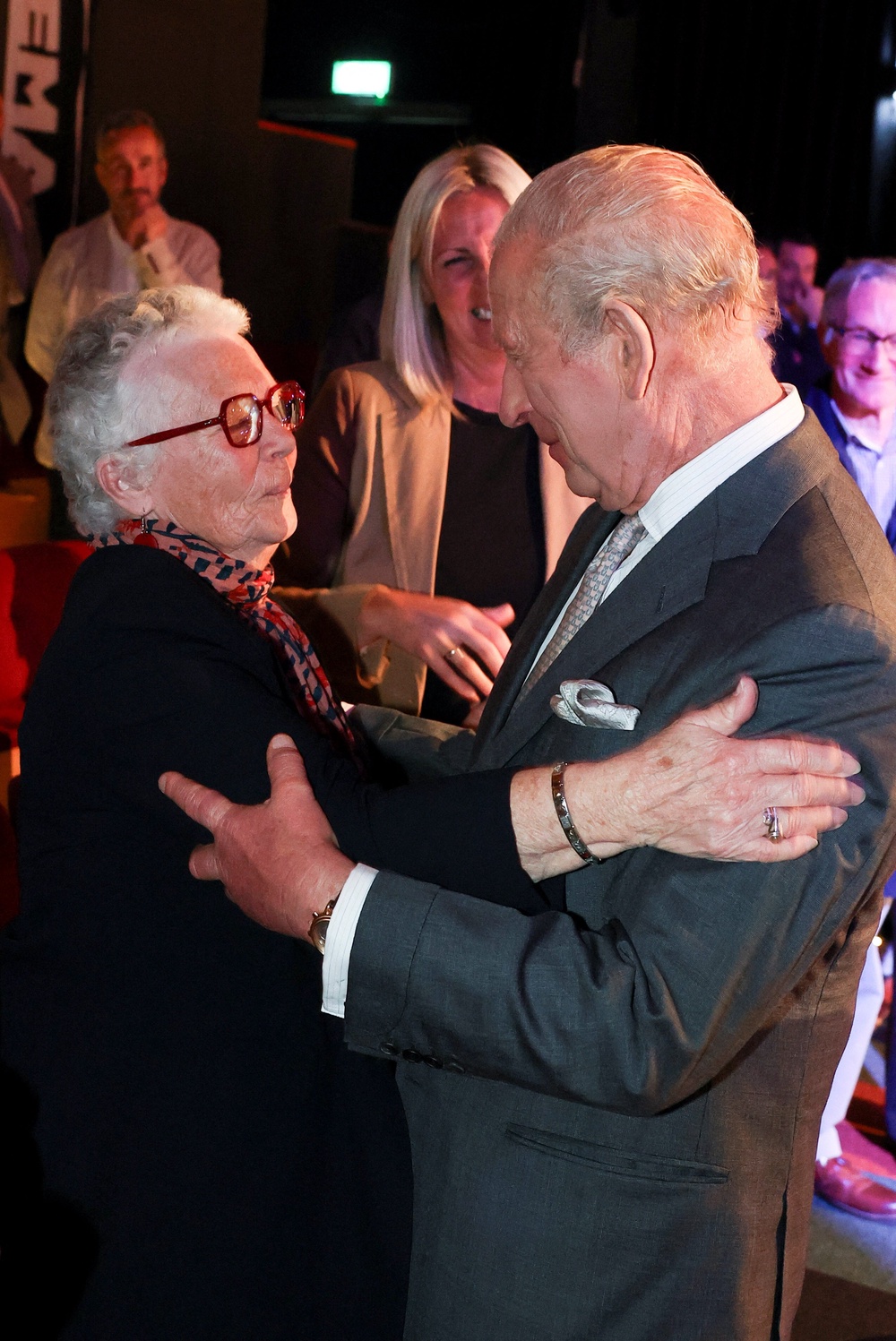 Charles embraces deaf actor Agnes Carberry, who stars in the Northern Ireland film A Quiet Voice with her husband John Carberry (Toby Melville/PA) (PA Wire)
