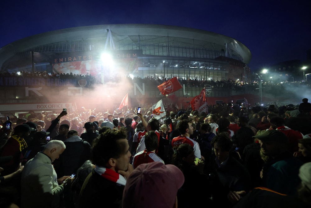 Arsenal players and fans partied long into the night (Reuters)