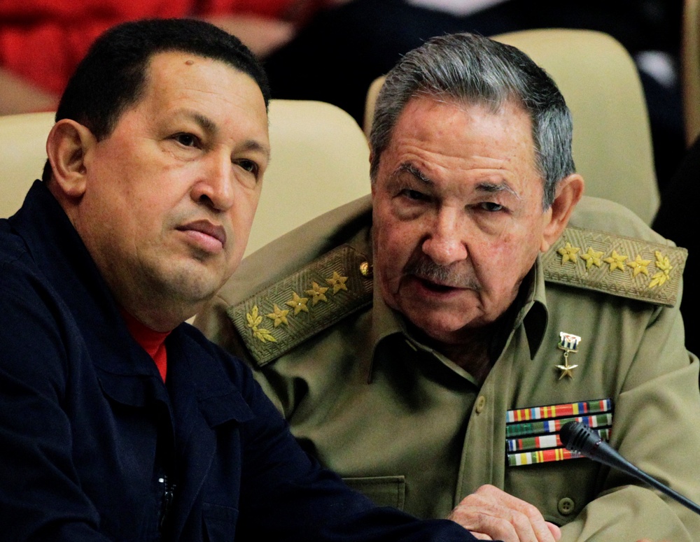 Cuba’s Raul Castro (R) speaks with his Venezuelan counterpart Hugo Chavez (L) in 2010 (Reuters)