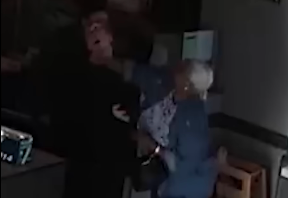 In the footage Grayson can be seen pushing the shift lead before hitting her in the face. The shift lead then leaps towards the elderly woman swinging her arms and causing the pair to fall to the ground (Fort Wayne Police Department)