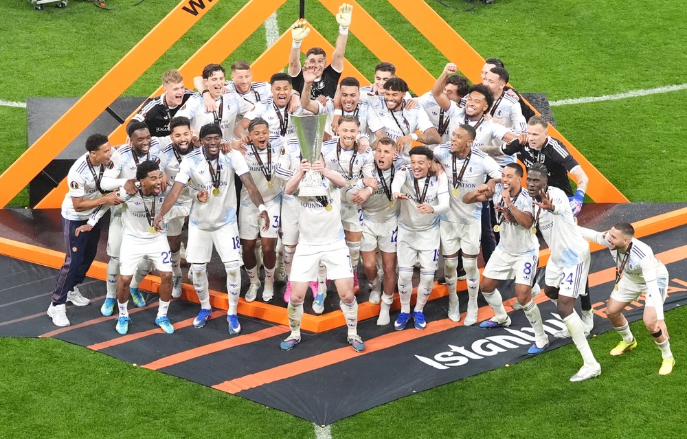 John McGinn (centre) lifts the trophy (Adam Davy/PA) (PA Wire)