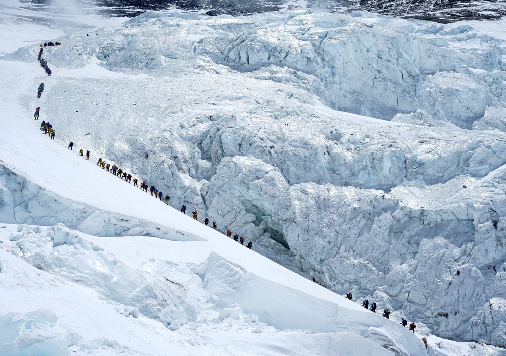 Climbers form a long queue as they head to the summit of Mount Everest (Reuters)