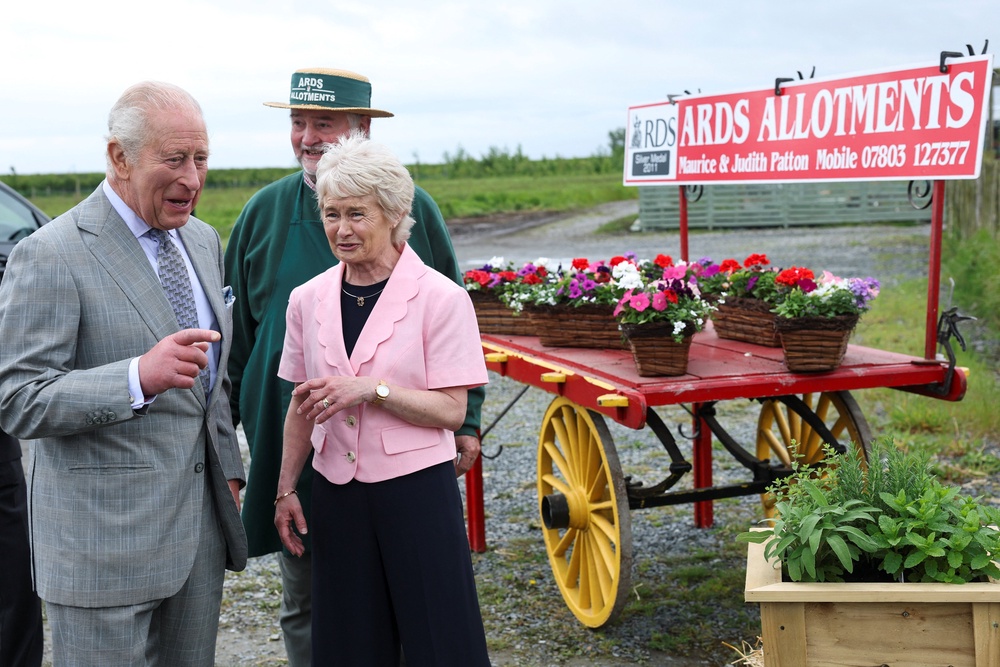 Charles with Judith Patton, wife of farmer Maurice Patton, the founder of Ards Allotments (Toby Melville/PA) (PA Wire)