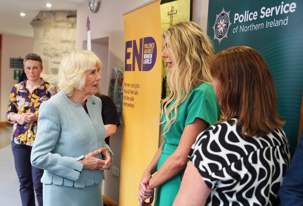 Camilla speaks to a representative from the Police Service of Northern Ireland as she meets staff and volunteers at Women’s Aid Newtownards (Aaron Chown/PA) (PA Wire)