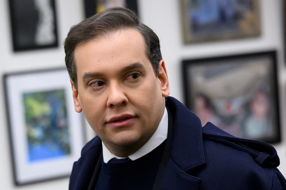 Former congressman George Santos says he plans to seek an apology from the government despite Trump commuting his prison sentence on identity theft and wire fraud charges (AFP/Getty)
