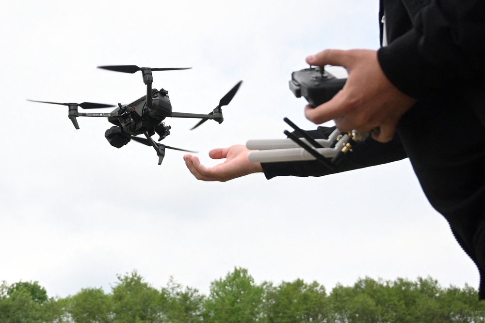 A man pilots a drone during the Wild Drones racing competition in Truskavets in the Lviv region of Ukraine (AFP/Getty)