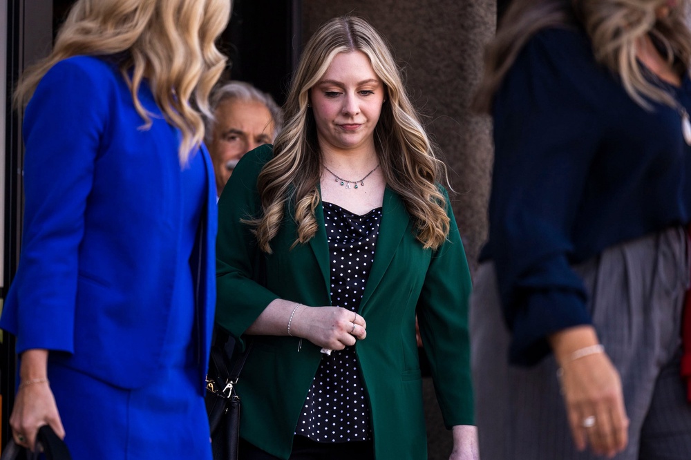Zwerner was shot at a reading table and spent nearly two weeks in hospital, undergoing six surgeries, and now lacks full use of her left hand. A bullet narrowly missed her heart and remains in her chest (Kendall Warner/The Virginian-Pil)