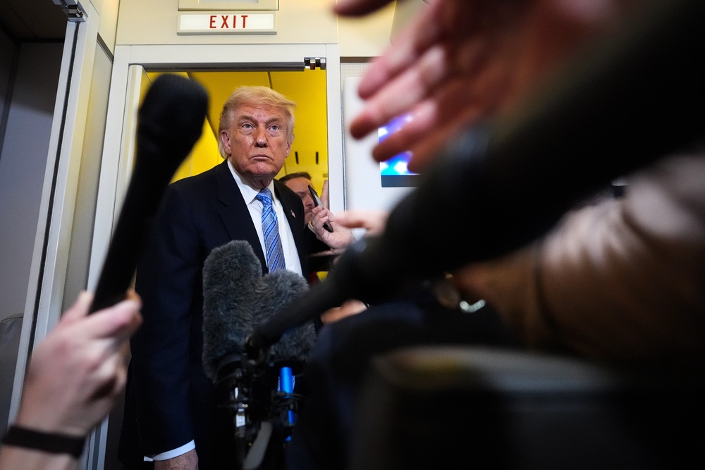 President Donald Trump speaks to reporters aboard Air Force One, Friday, May 15, 2026, as he returns from a trip to Beijing (Copyright 2026 The Associated Press. All rights reserved.)