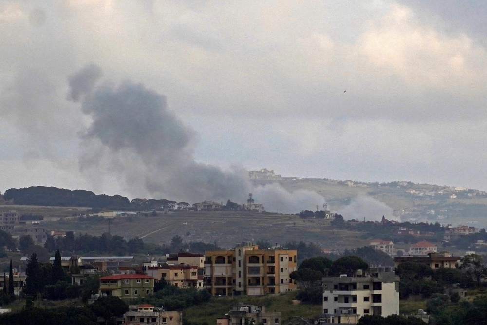 Smoke rises from the site of an Israeli strike that targeted the southern Lebanese village of Kfar Tibnit on May 21 (AFP/Getty)